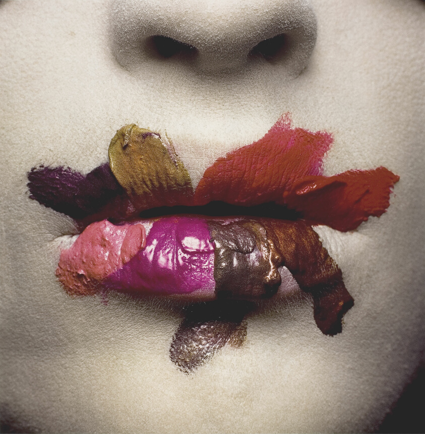 Photograh by Irving Penn titled Mouth (for L’Oréal), New York and depicting a closeup of a woman's lips with various shades of lipstick applied in swatches